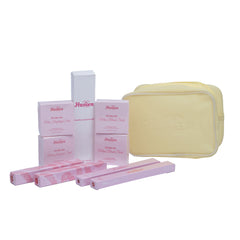 Set of skincare products including boxes, a bar of soap, and rolled-up items on a white background.