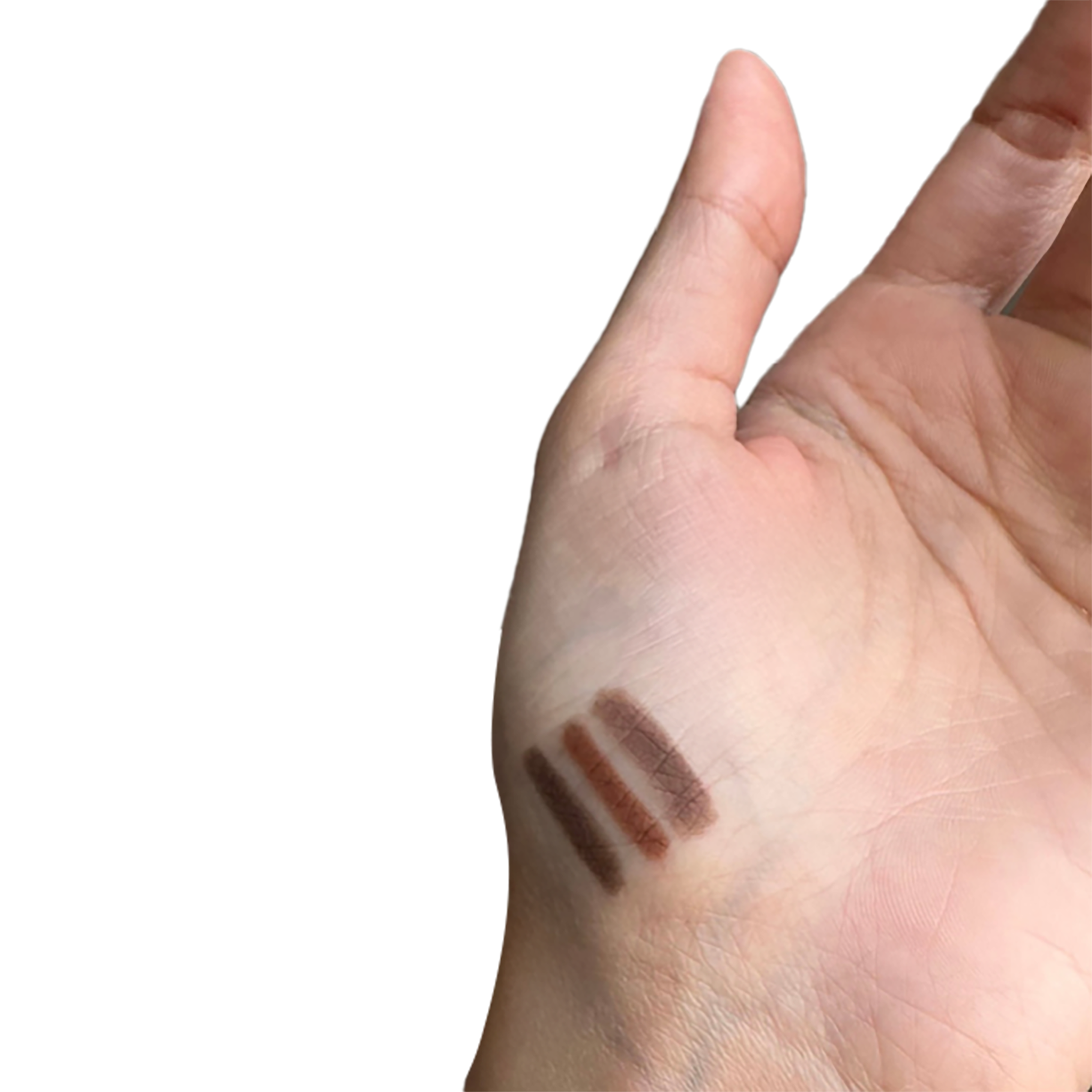 Three brown makeup swatches on a person's hand against a white background