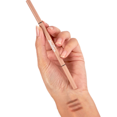 Hand holding a makeup pencil with 'Italia' branding on a white background
