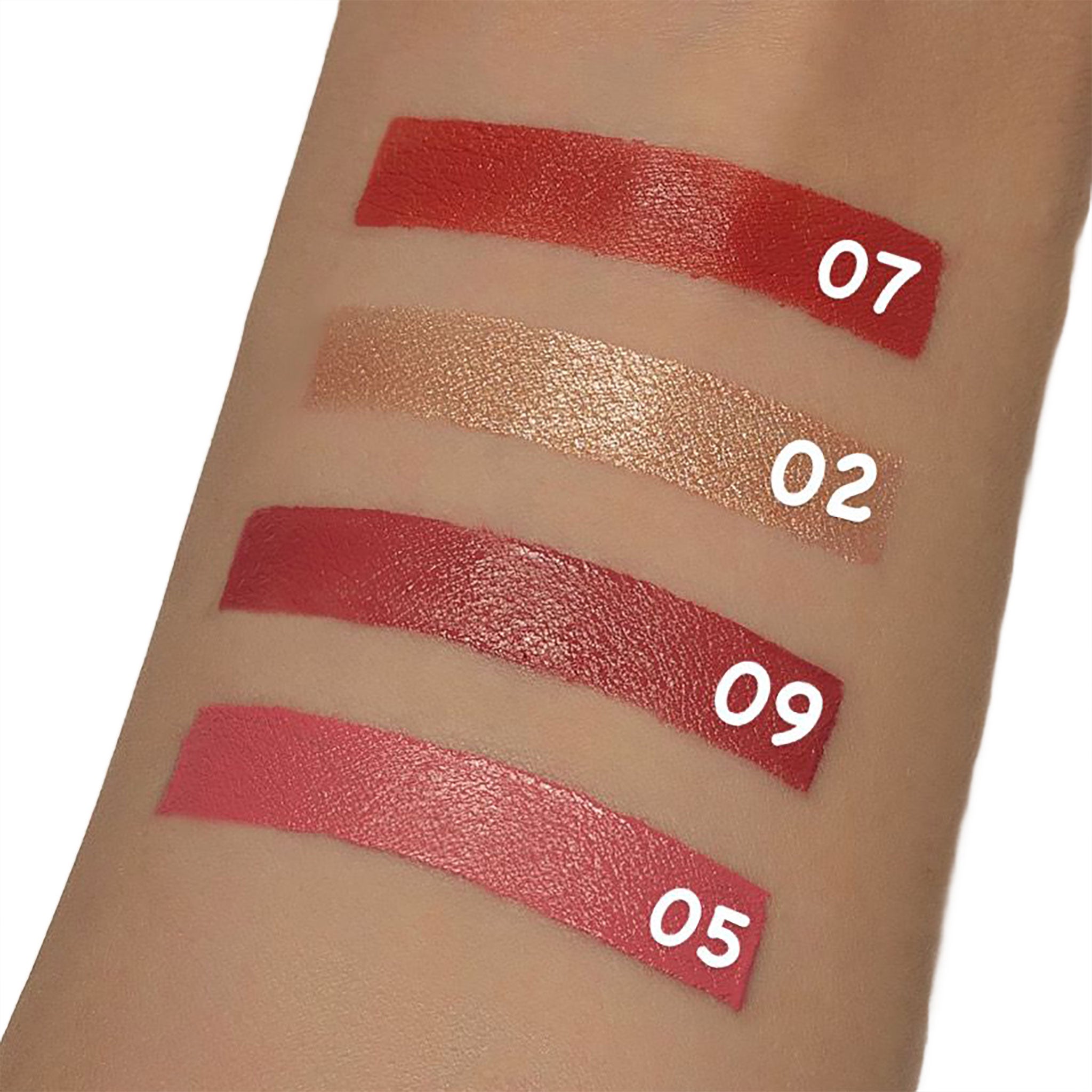 Lipstick swatches on a person's arm with color numbers