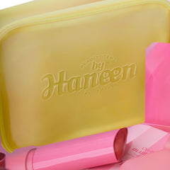 Yellow case with 'Beauty Items by Haneen' branding, containing pink items.