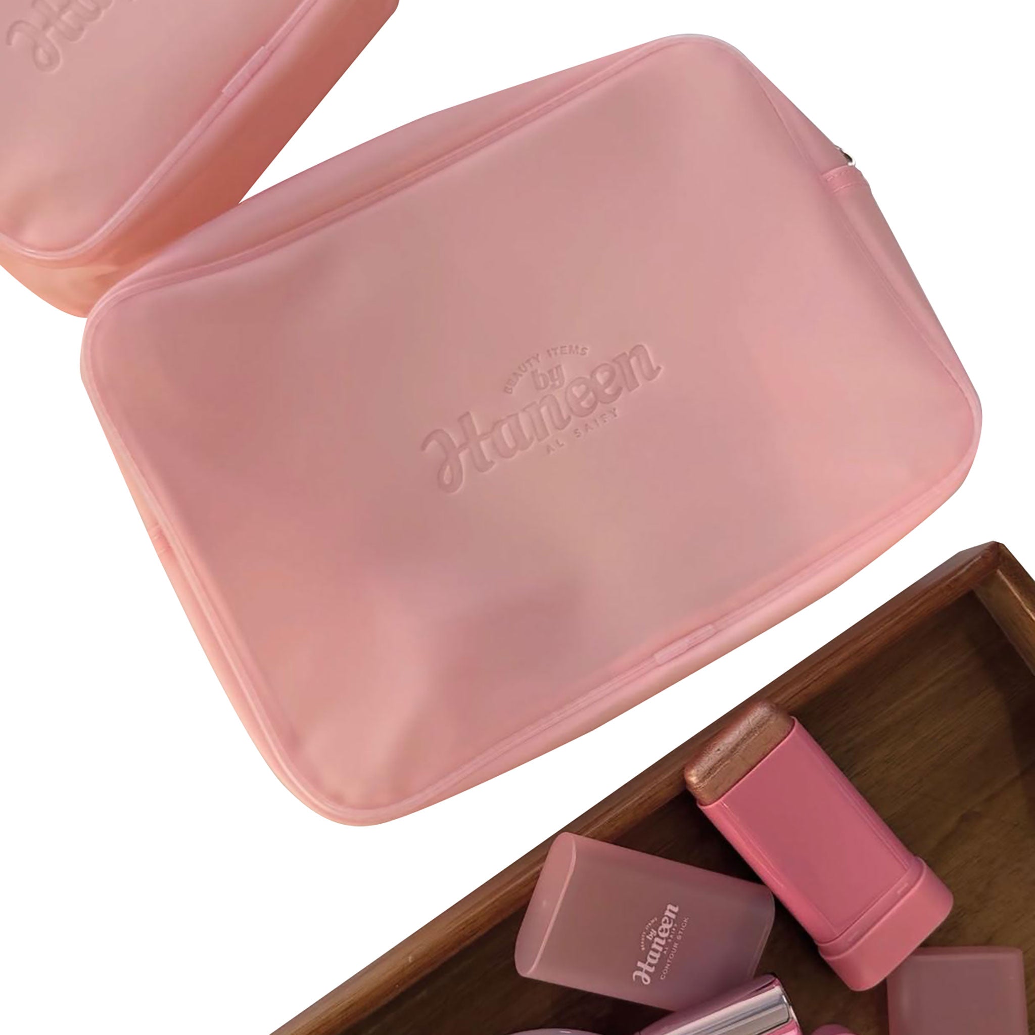 Pink cosmetic case with 'Haeun' branding on a white background