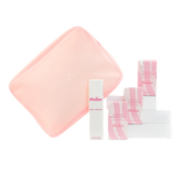 Set of skincare products with pink and white packaging on a white background