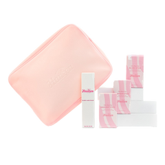 Set of skincare products with pink and white packaging on a white background