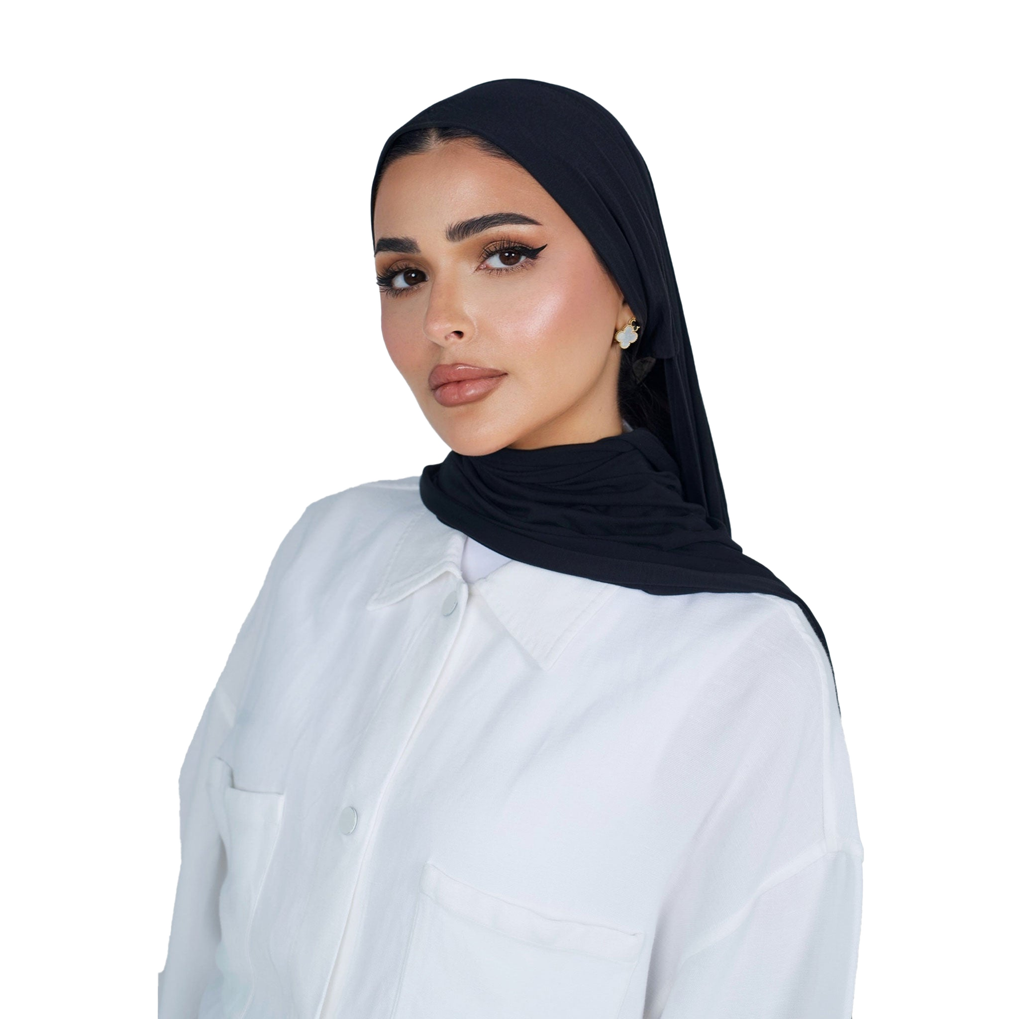 Woman wearing a black hijab and white shirt on a white background