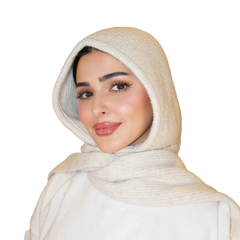 Woman wearing a beige hijab on a white background