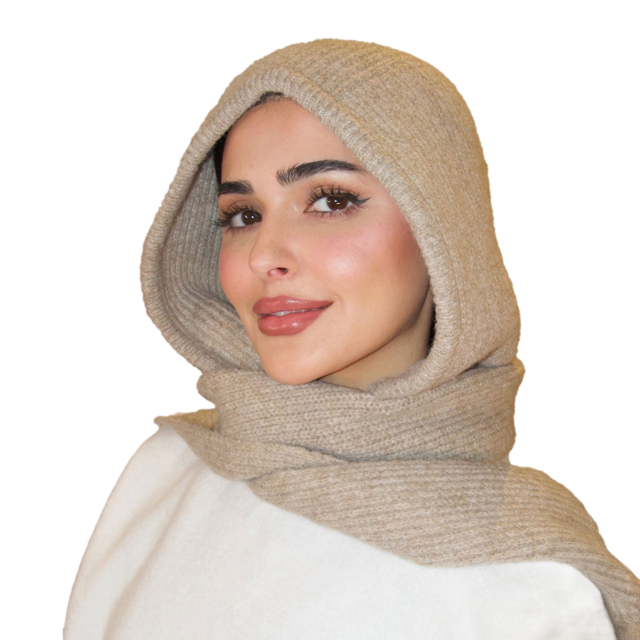 Woman wearing a beige hijab on a white background