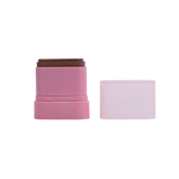 Pink cosmetic stick with brown top on a white background