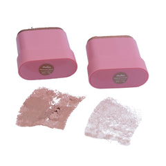 Two pink containers with makeup samples on a white background