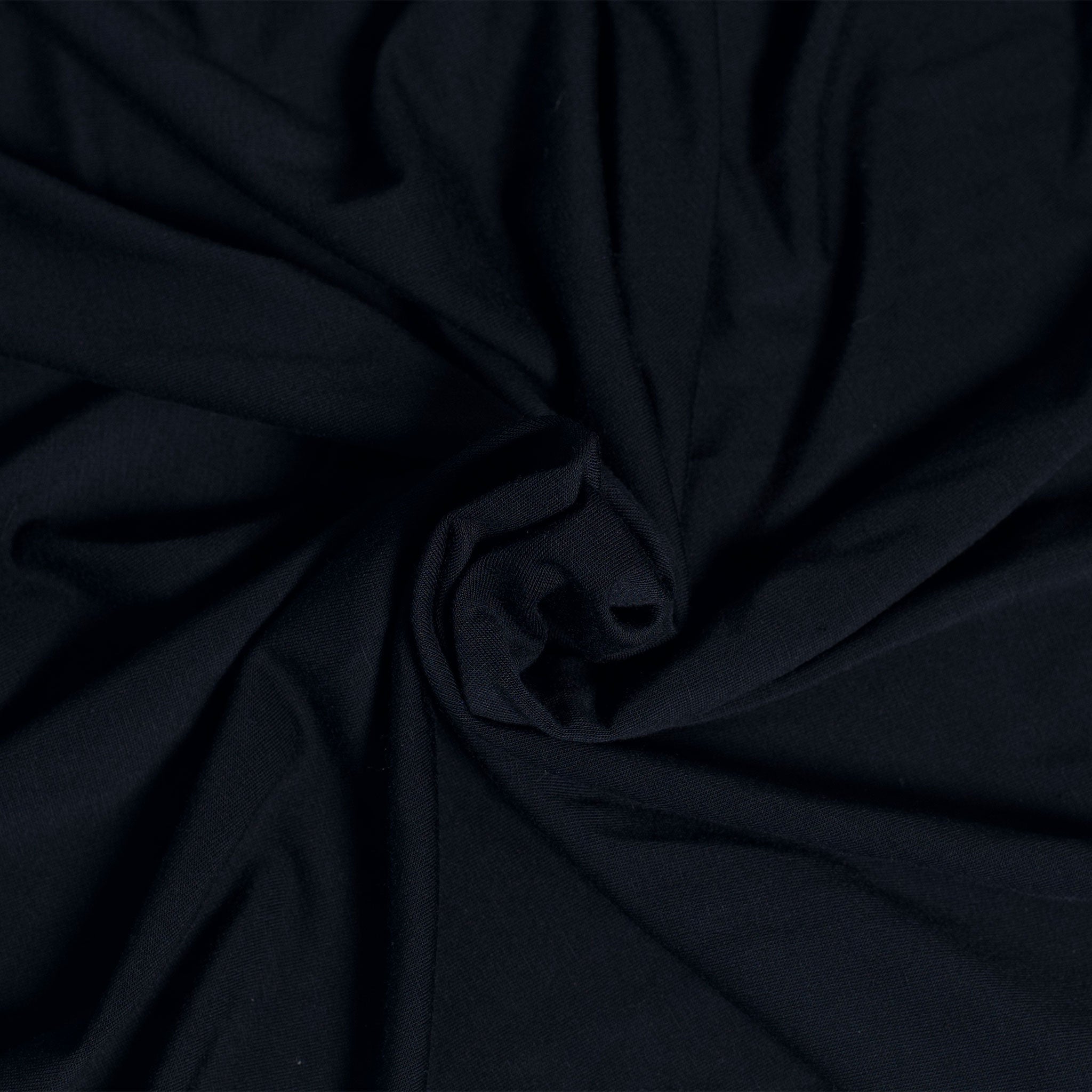 Close-up of dark blue fabric with folds
