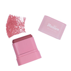 Pink makeup product with open case and sample on a white background