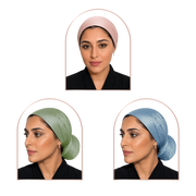 Three arched portrait frames show a woman modeling a textured hijab in different colors: light pink at the top, sage green at bottom left, and dusty blue at bottom right. The woman wears a black top against a plain white background.