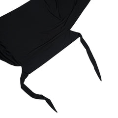 Black fabric with a draped effect on a white background