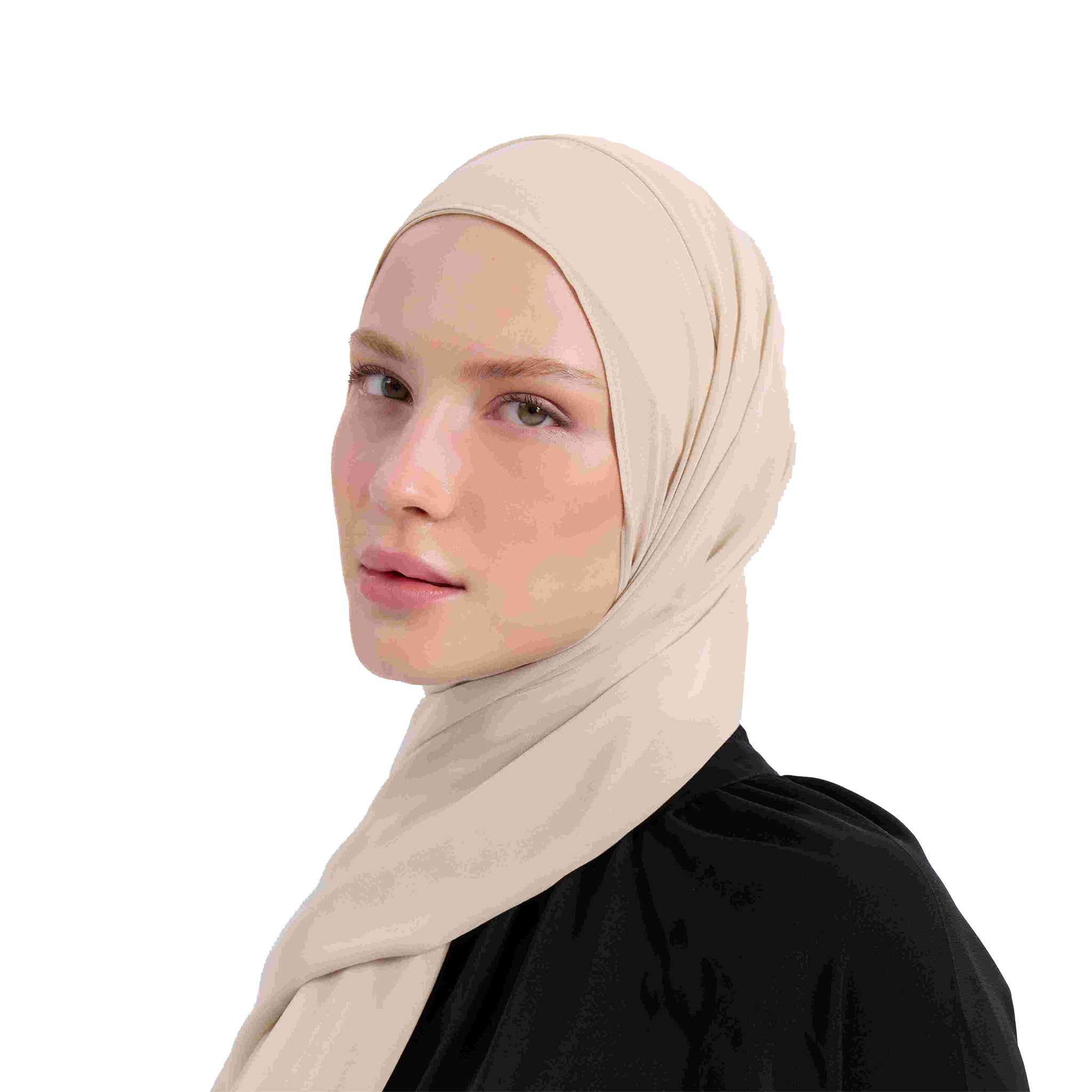 Woman wearing a beige hijab on a white background