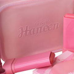 Pink cosmetic set with 'Beauty Items by Haneen' branding on a white background