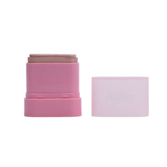Pink makeup stick with a white cap on a white background
