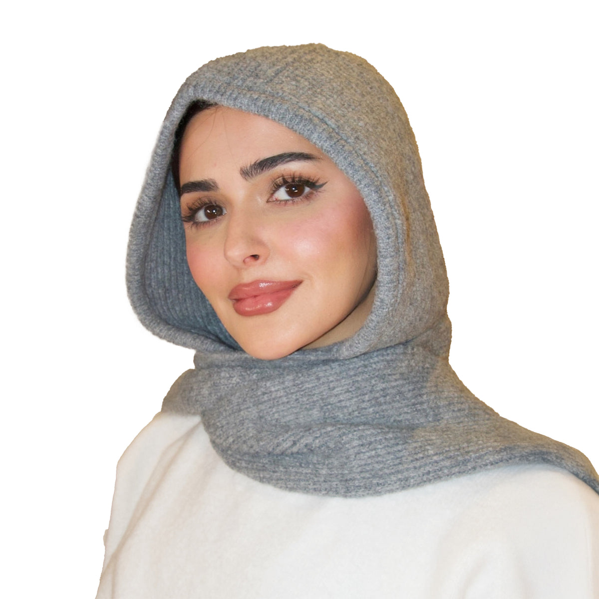 Woman wearing a gray hooded scarf on a white background