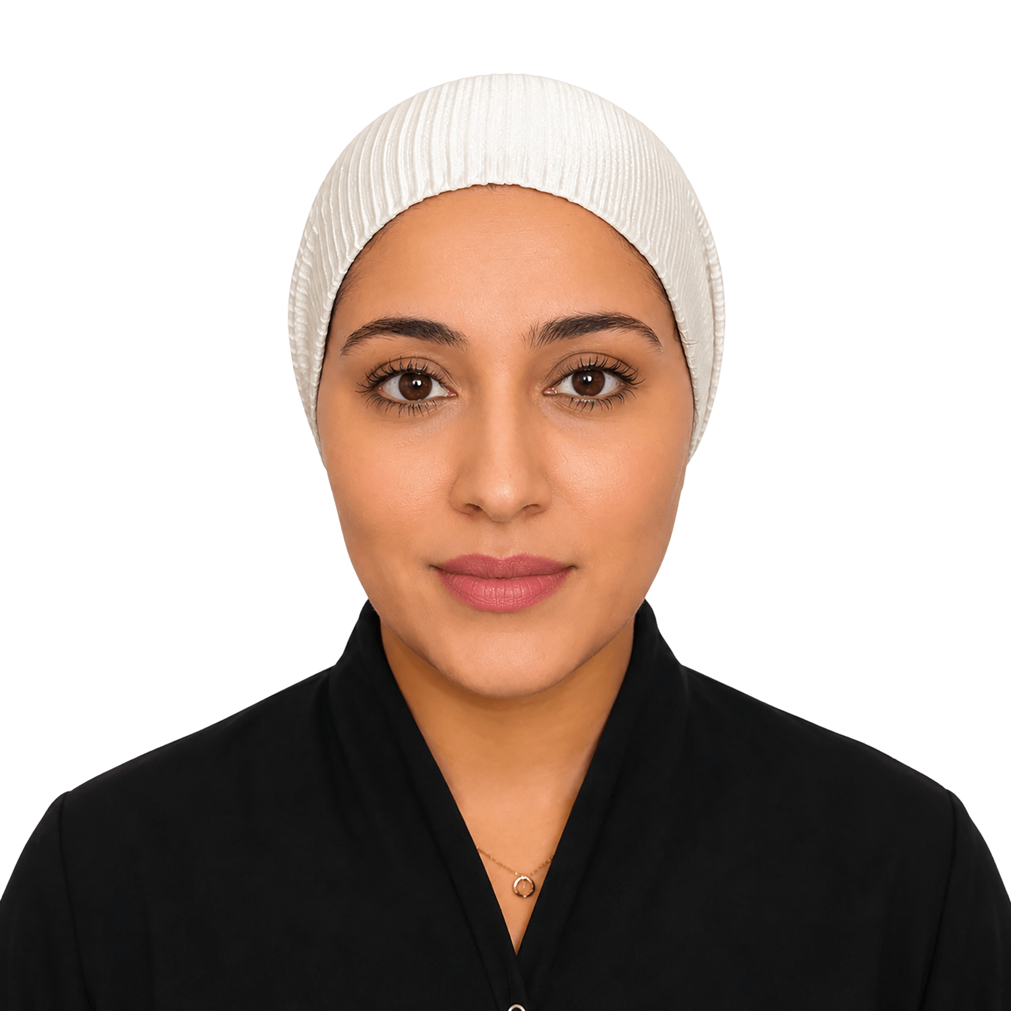 A woman wearing a white ribbed hijab and a black top, photographed against a solid black background.