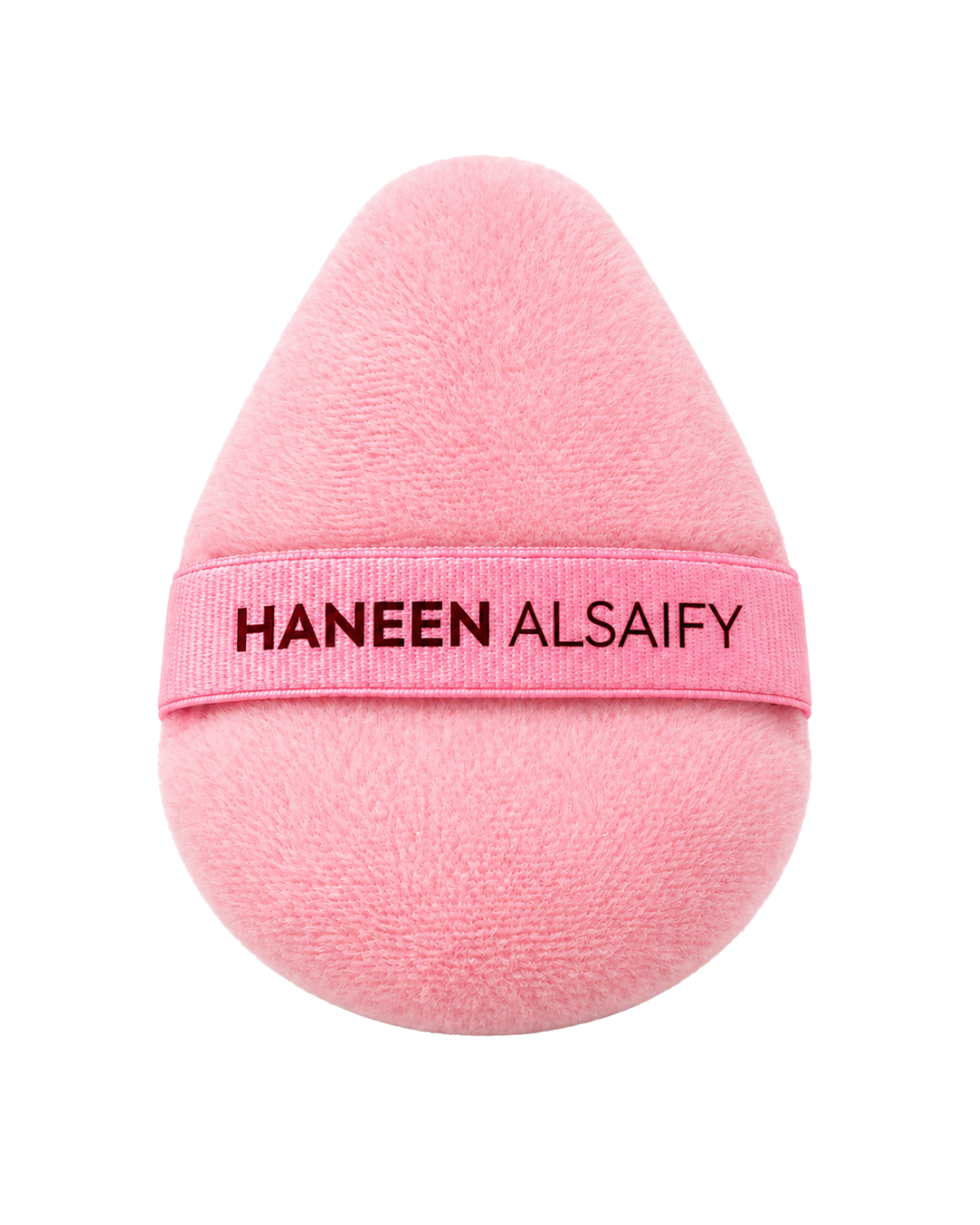 A pink teardrop-shaped makeup sponge with a matching pink band around the middle that reads 'HANEEN ALSAIFY' in black text, shown on a plain white background.