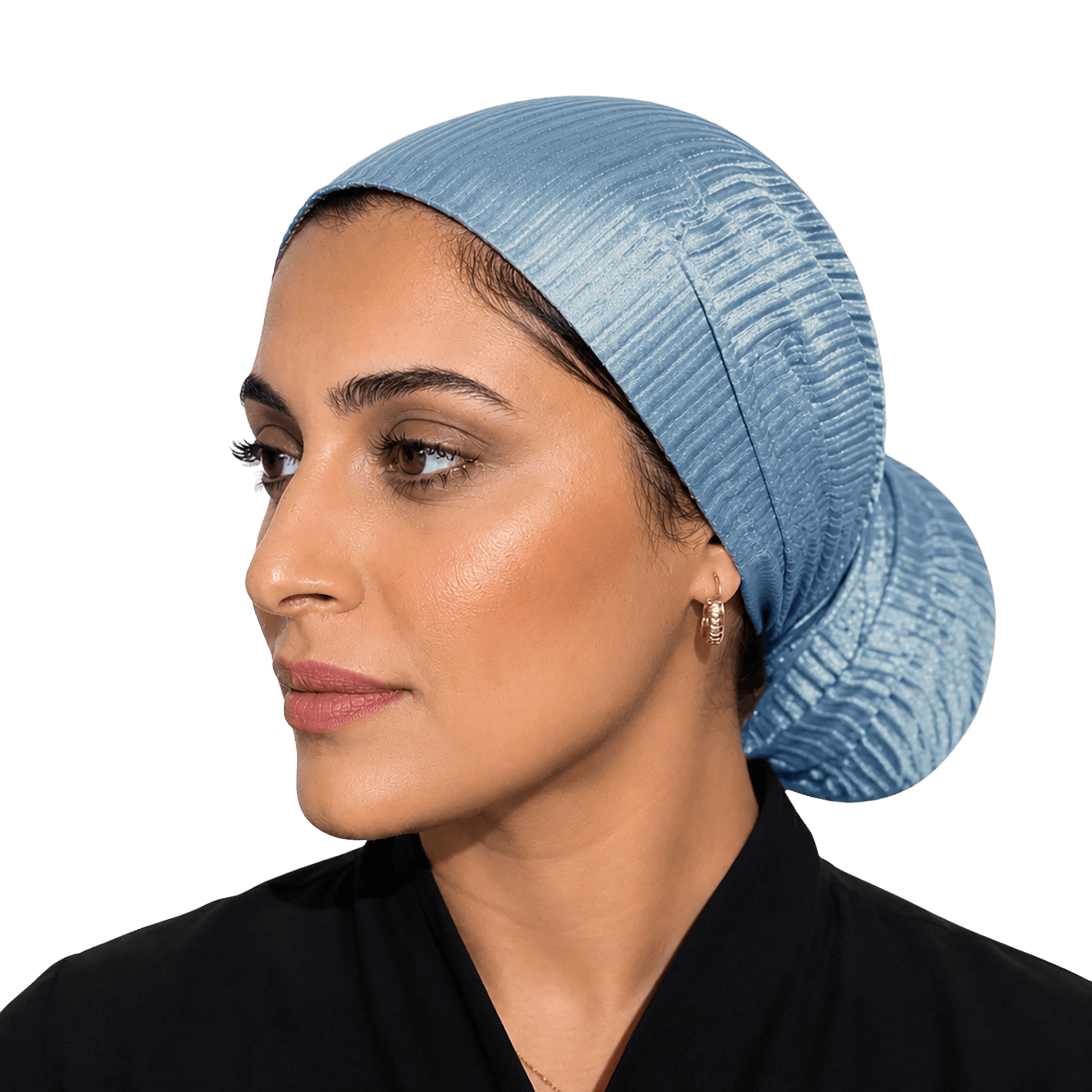 A woman shown in profile wearing a light blue textured fabric head covering or hijab against a solid black background.