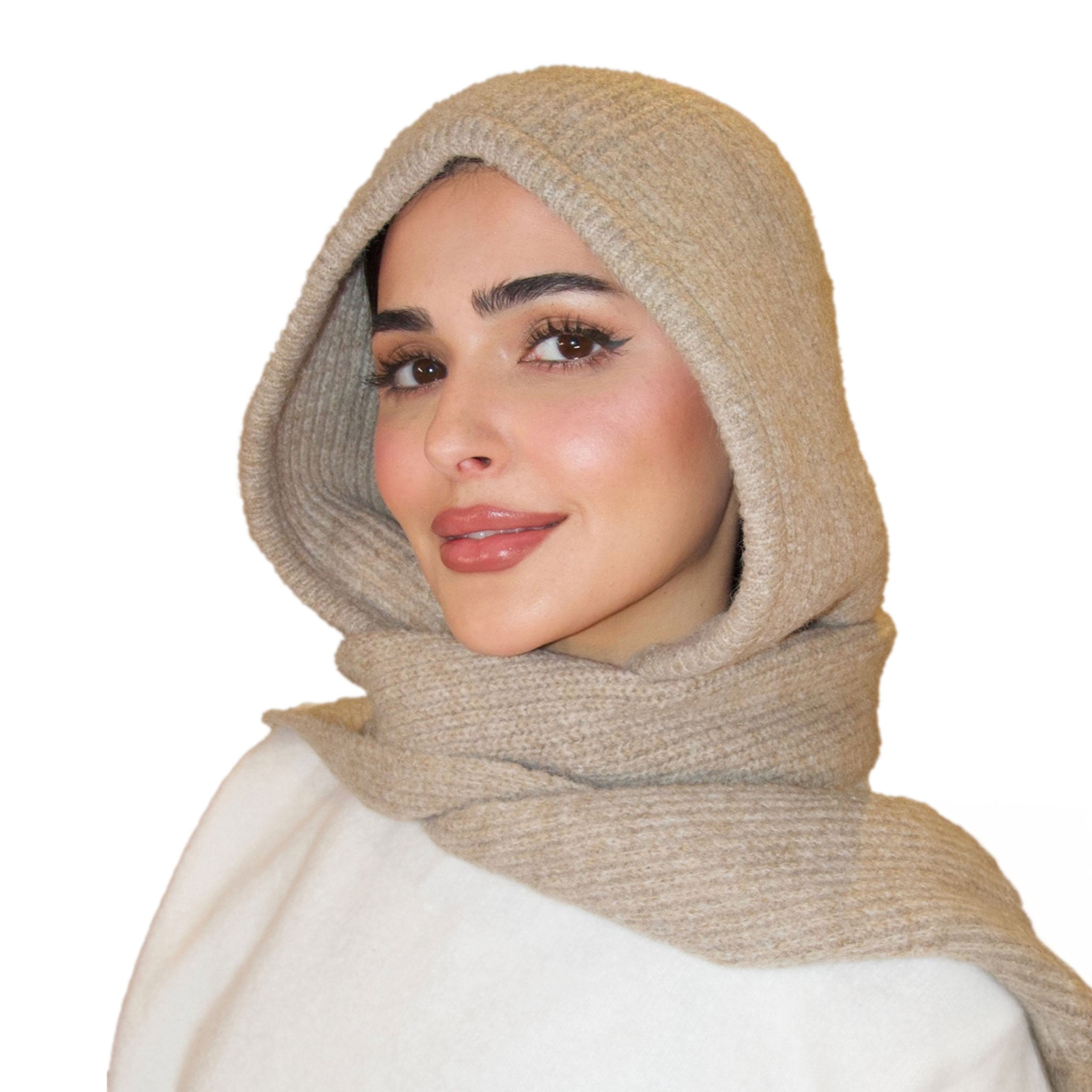 Woman wearing a beige hijab on a white background