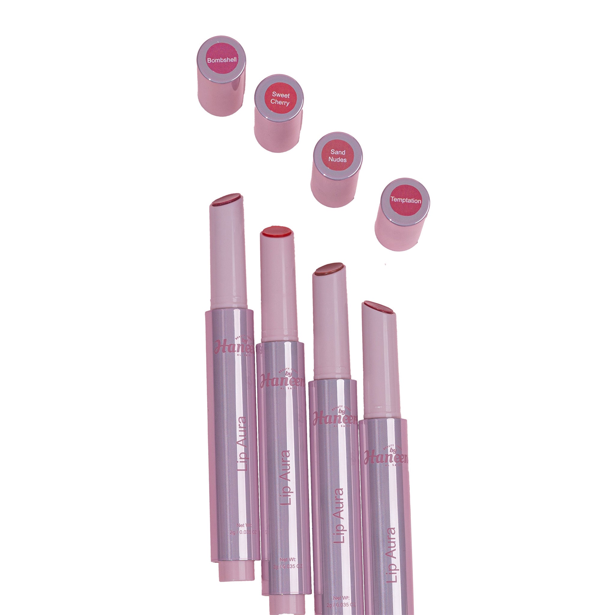 Set of pink lipsticks with open caps on a white background