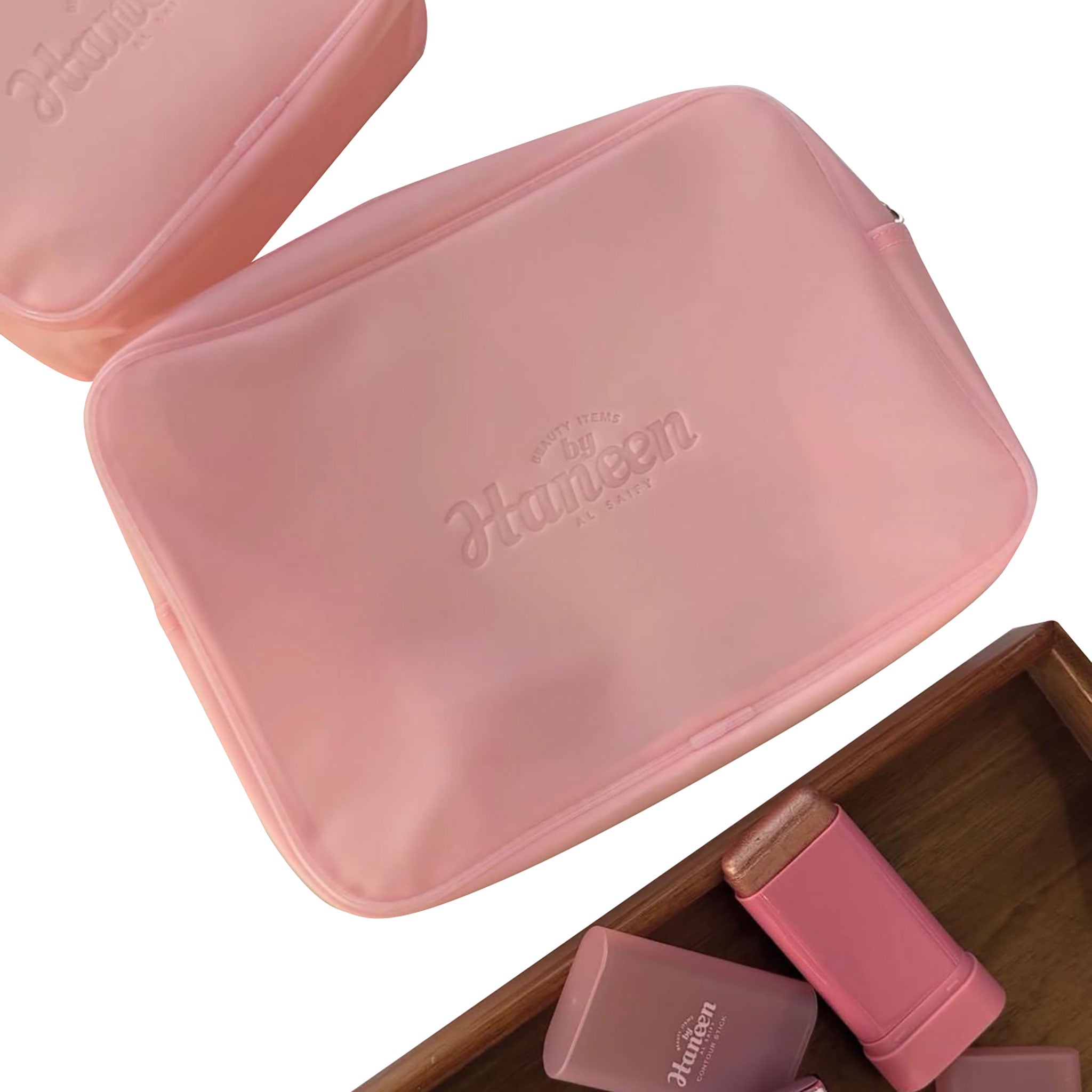 Pink cosmetic case with 'Kanebo' branding on a white background