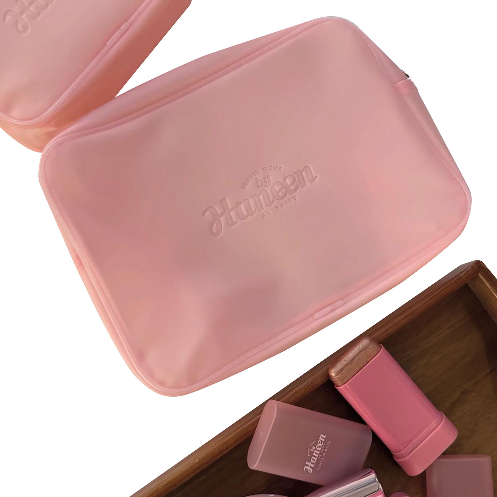 Pink cosmetic case with 'Haeun' branding on a white background