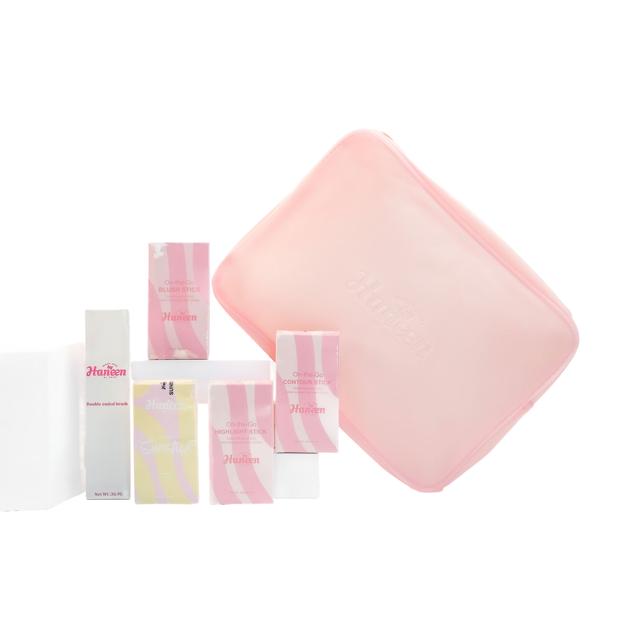 Set of pink and white skincare products with a pink square item on a white background