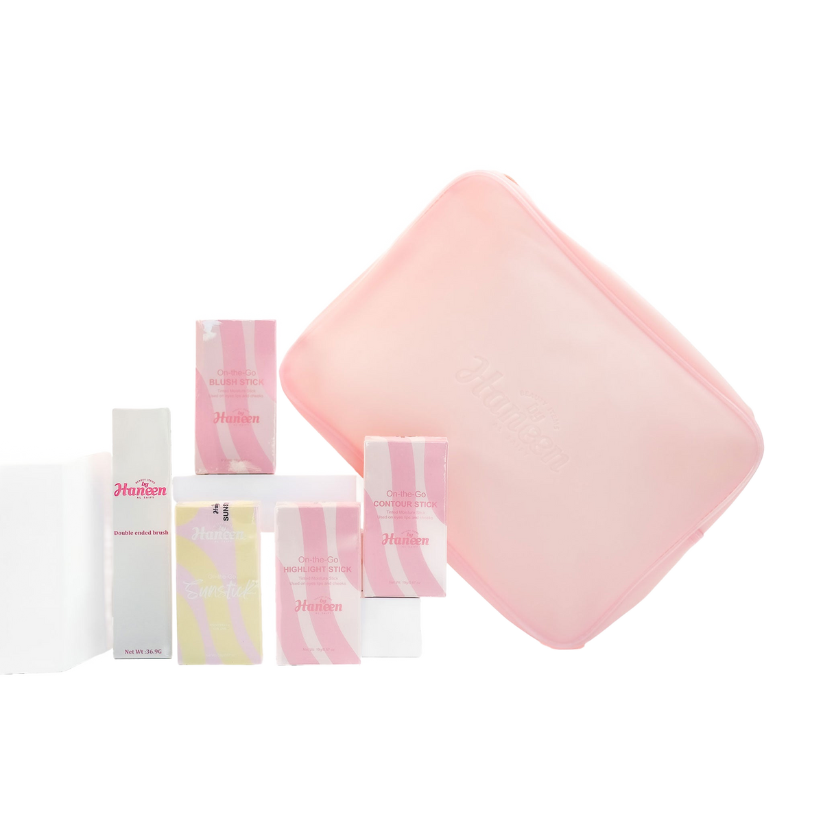Set of pink and white skincare products with a pink square item on a white background