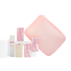Set of pink and white skincare products with a pink square item on a white background