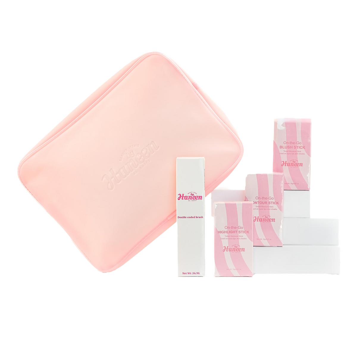 Set of skincare products with pink and white packaging on a white background