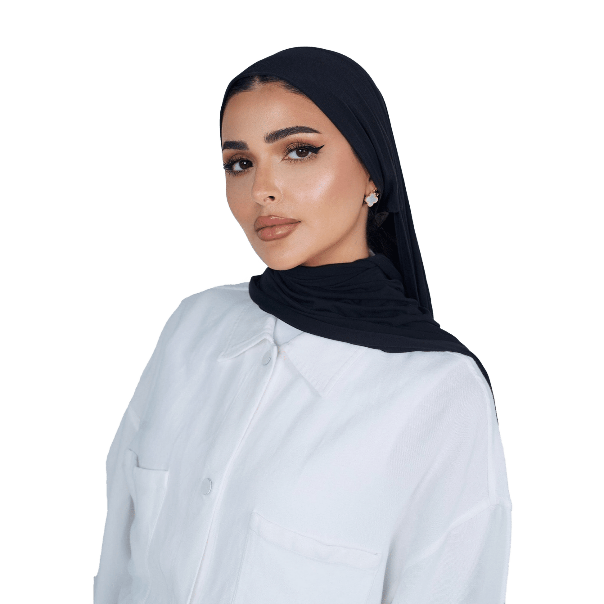 Woman wearing a black hijab and white shirt on a white background