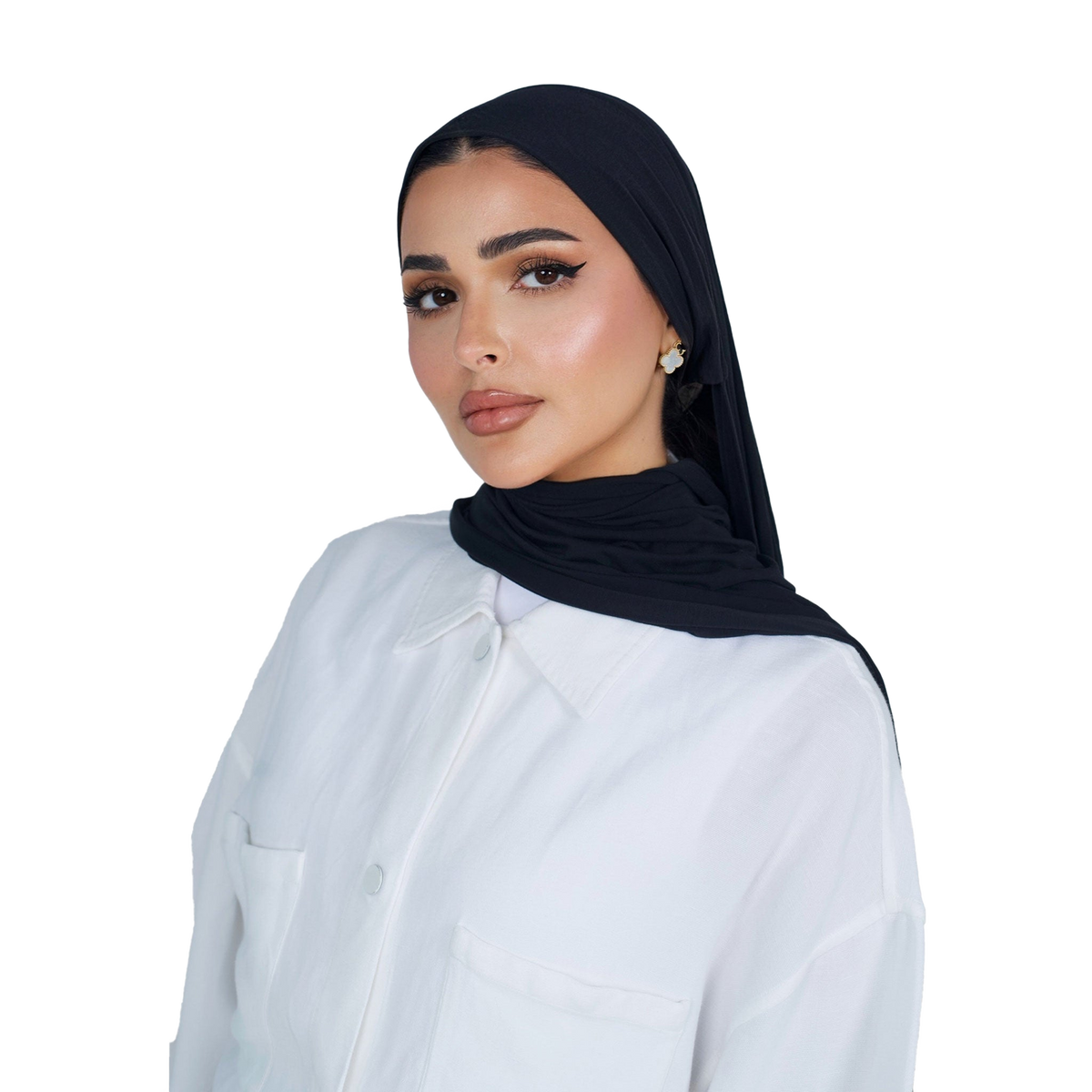 Woman wearing a black hijab and white shirt on a white background