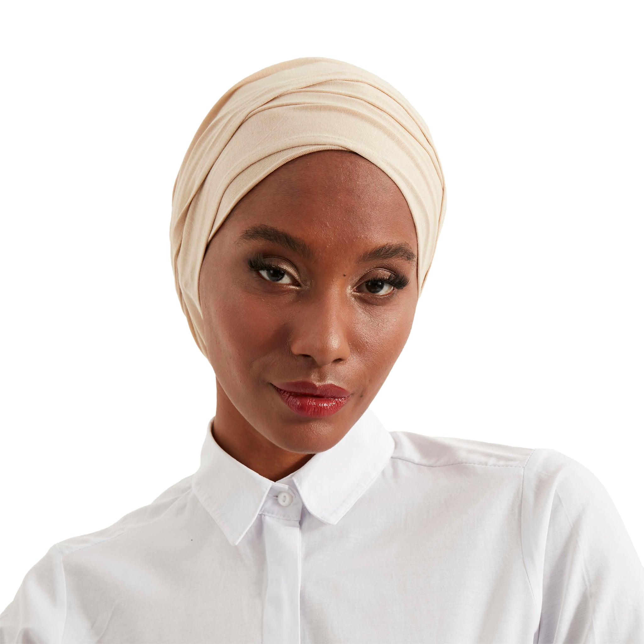 Woman wearing a beige headscarf and white shirt on a white background