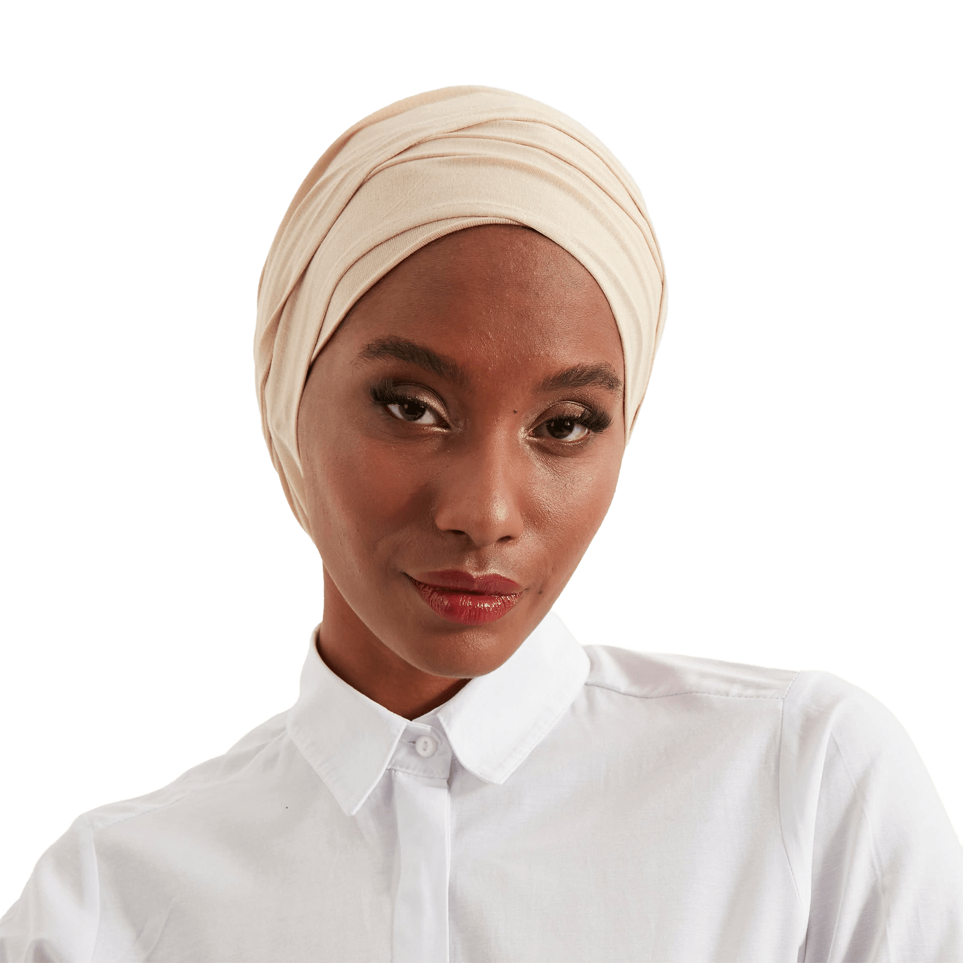 Woman wearing a beige headscarf and white shirt on a white background