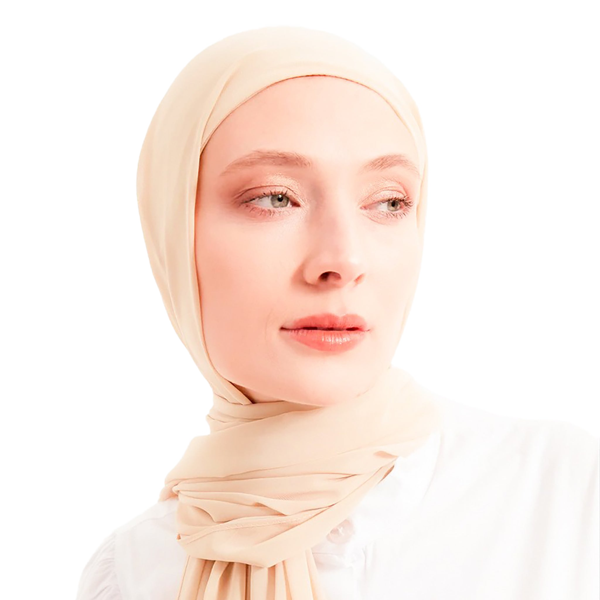 Woman wearing a beige hijab against a white background