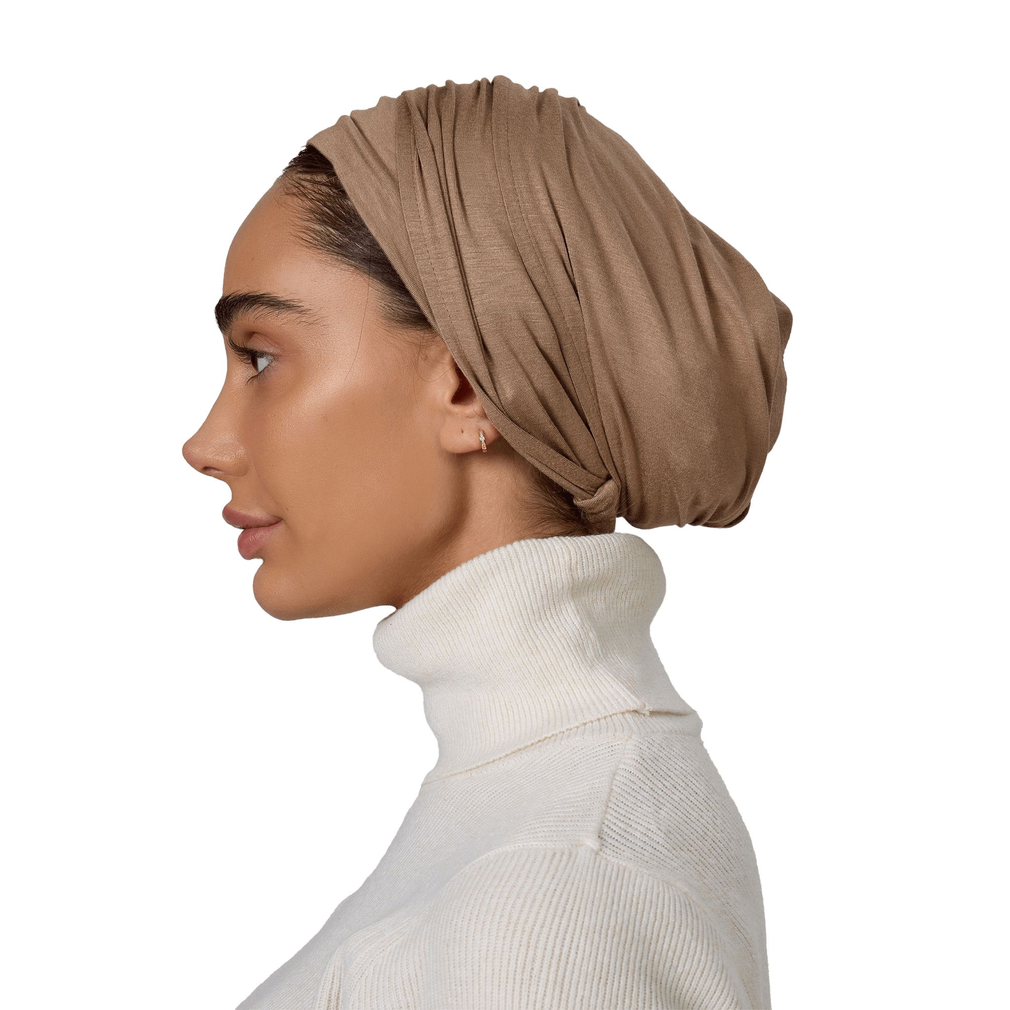 Woman wearing a beige headscarf and white turtleneck on a white background