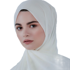 Woman wearing a white hijab on a white background
