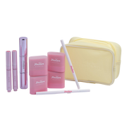 Set of pink and yellow makeup items with 'Haven' branding on a white background