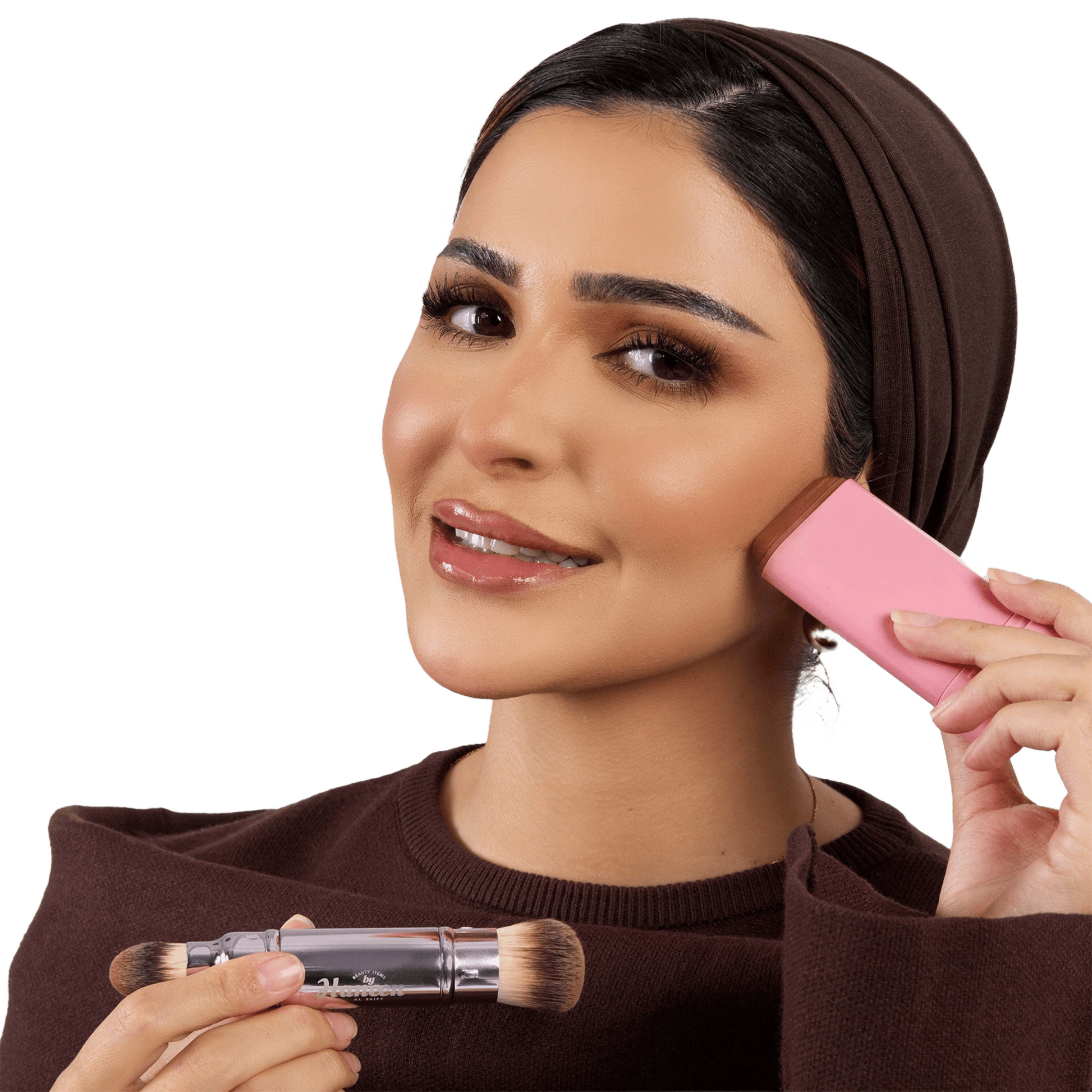 Woman applying makeup with a pink brush and clear container on a white background