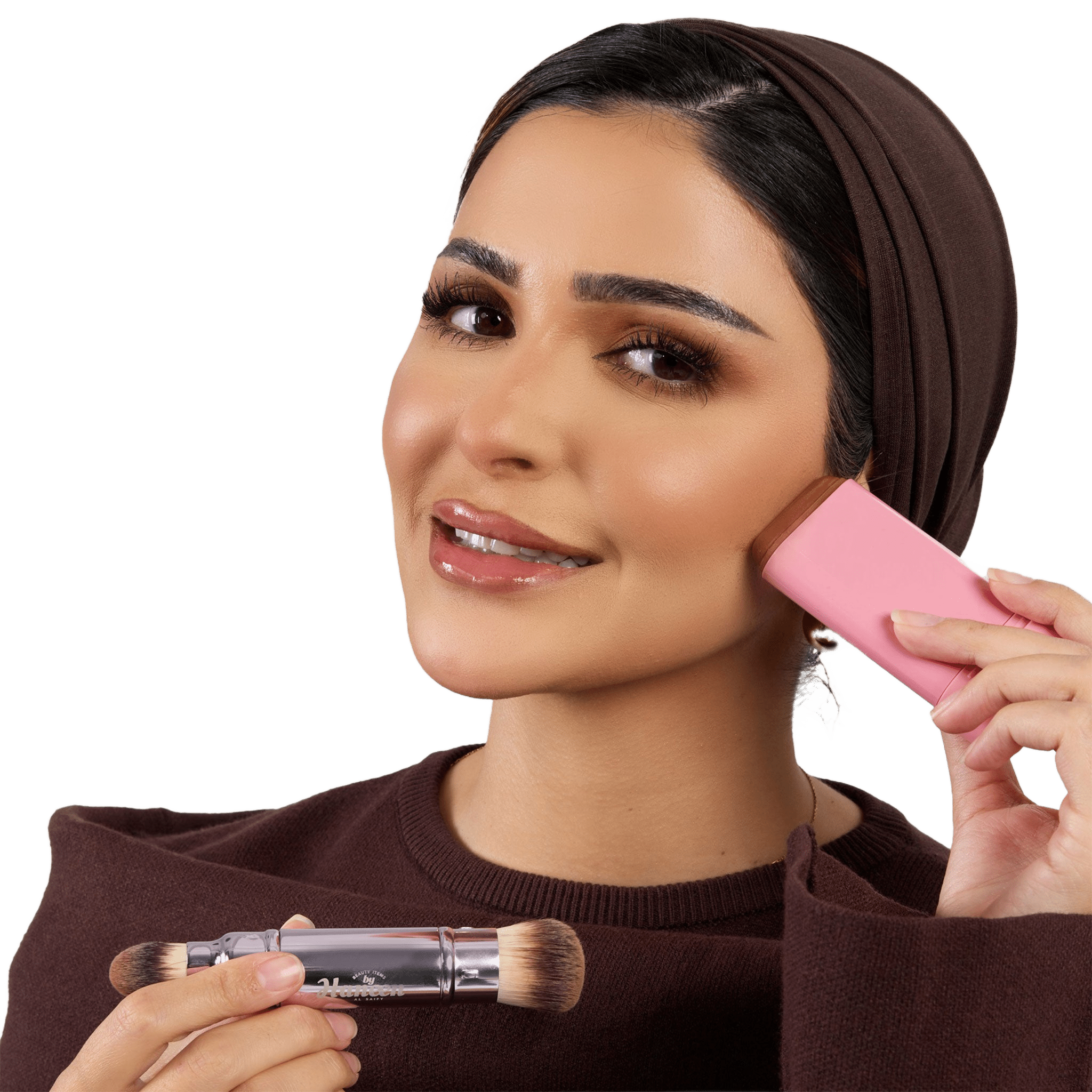 Woman applying makeup with a pink brush and clear container on a white background