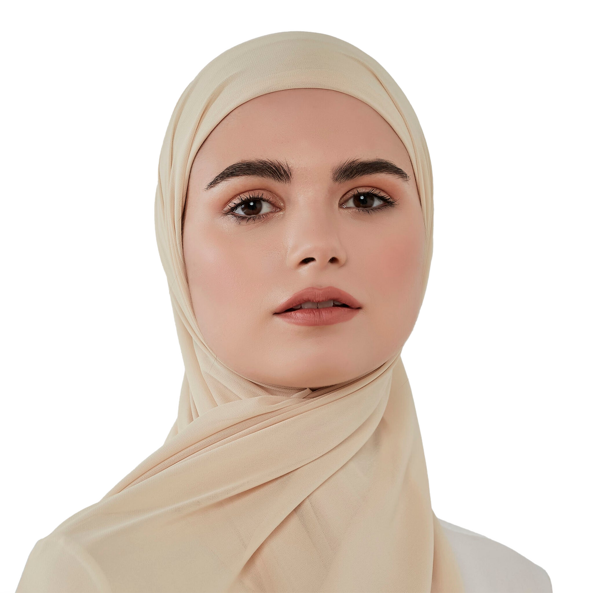 Woman wearing a beige hijab against a white background